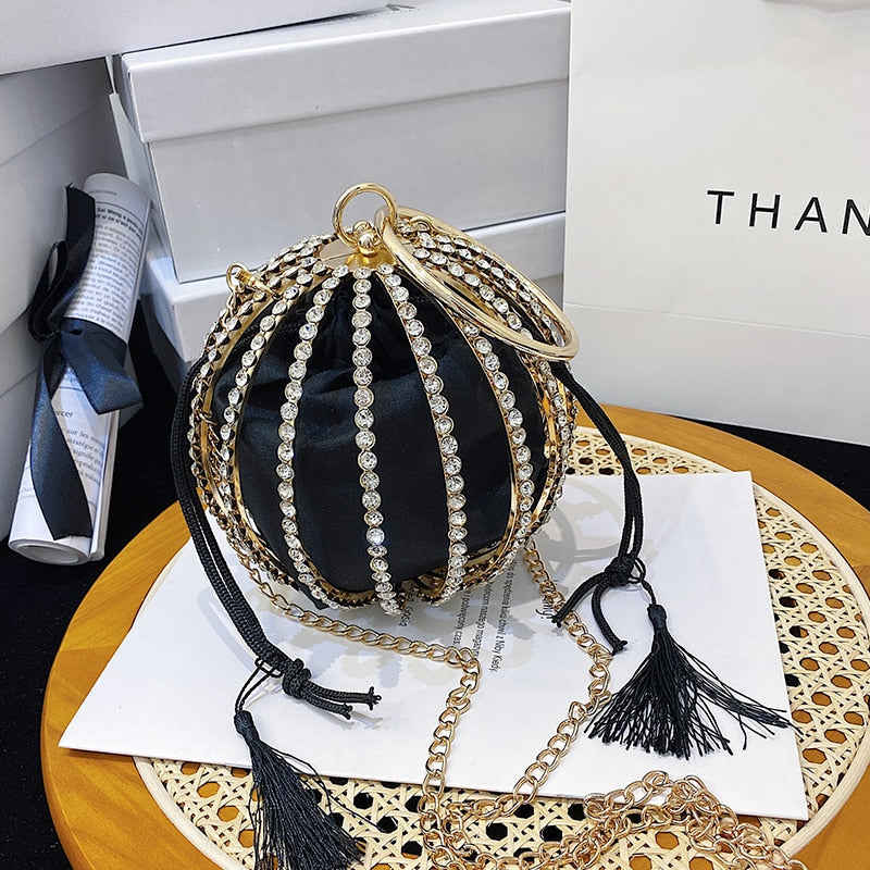 Luxurious diamond pearl flower metal ball handbag on a table, perfect for weddings and stylish occasions.