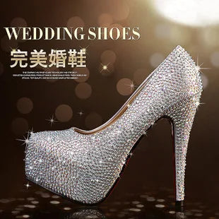 a woman's high heeled shoe with crystal stones