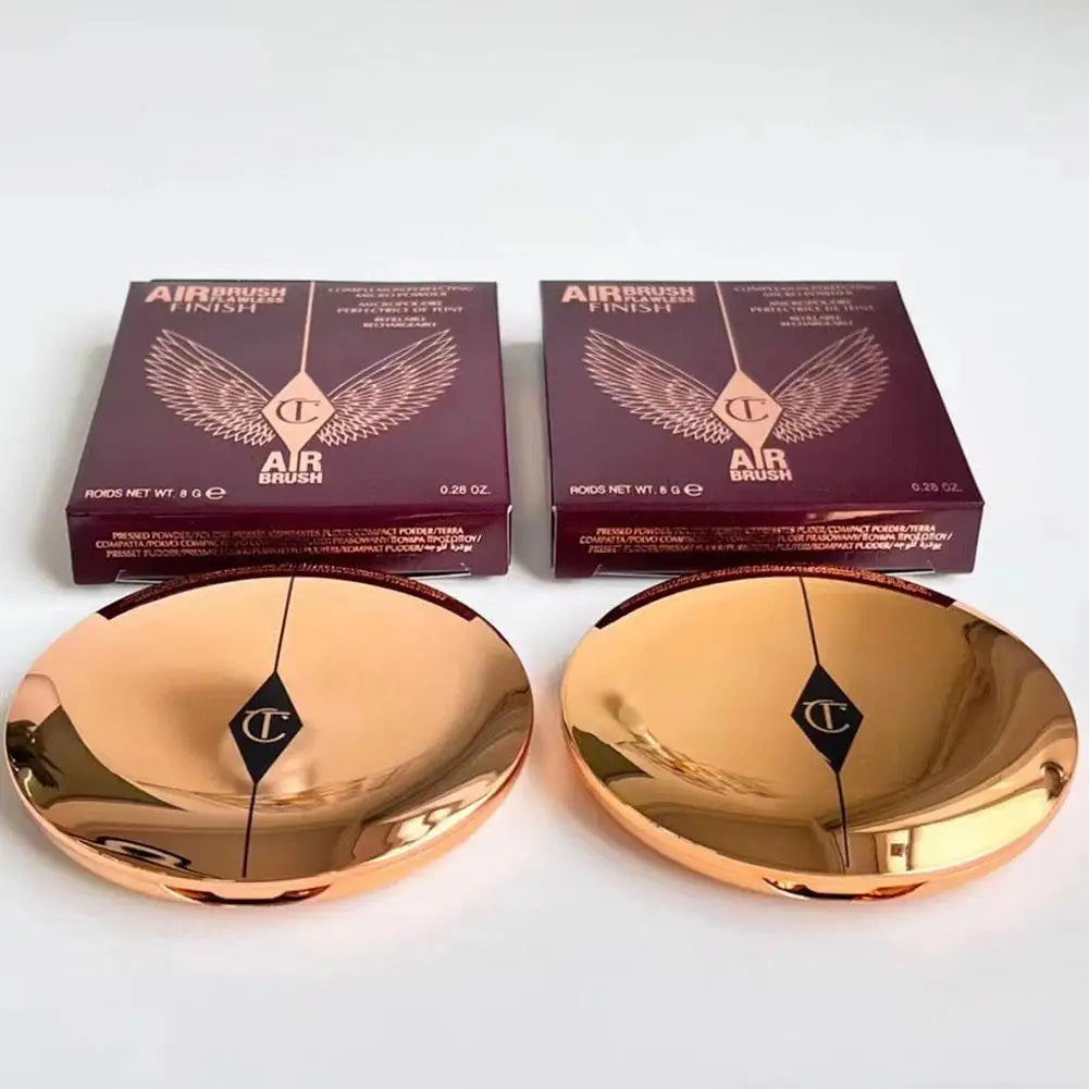 Charlotte Tilbury Airbrush Flawless Finish Powder packaging and products, showcasing the luxurious bronze compacts.