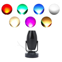 a set of four different colored lights on a white background