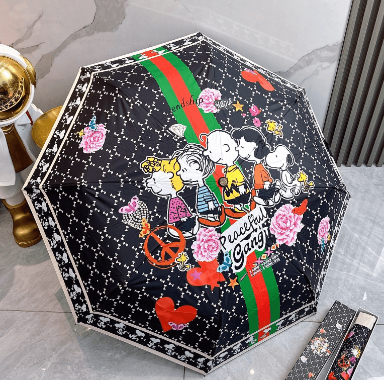 Elegant printed umbrella showcasing vibrant 'Friendship' design with playful characters and floral accents.