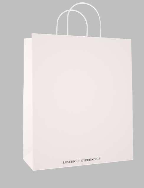 White paper bag with 'Luxurious Weddings NZ' text on a light gray background