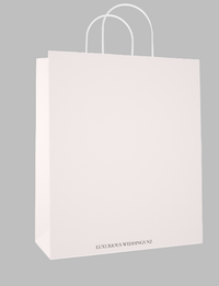 White paper bag with 'Luxurious Weddings NZ' text on a light gray background