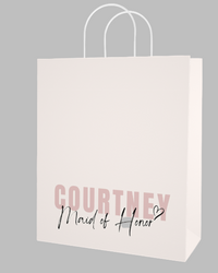 Gift bag with 'Courtney Maid of Honor' text on a light background
