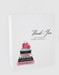 White tote bag with black text and pink and black book design on a white background