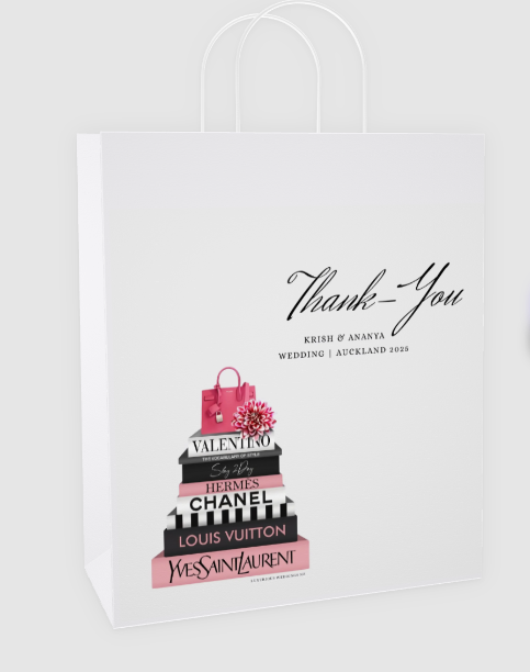White tote bag with black text and pink and black book design on a white background