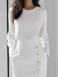 Long Sleeve Button Detail Midi Dress with Side Slit showcasing button details and pockets in a stylish white design.