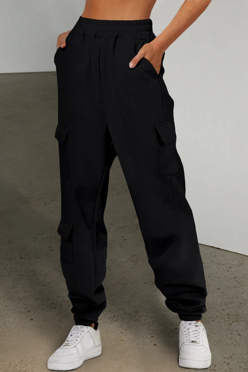 Black pocketed elastic waist active joggers for women, featuring a comfortable fit and versatile style.
