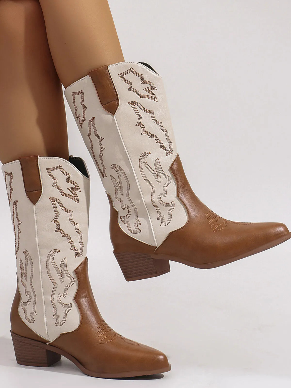 Point toe block heel boots in brown and cream with western-style embroidery on the shaft.