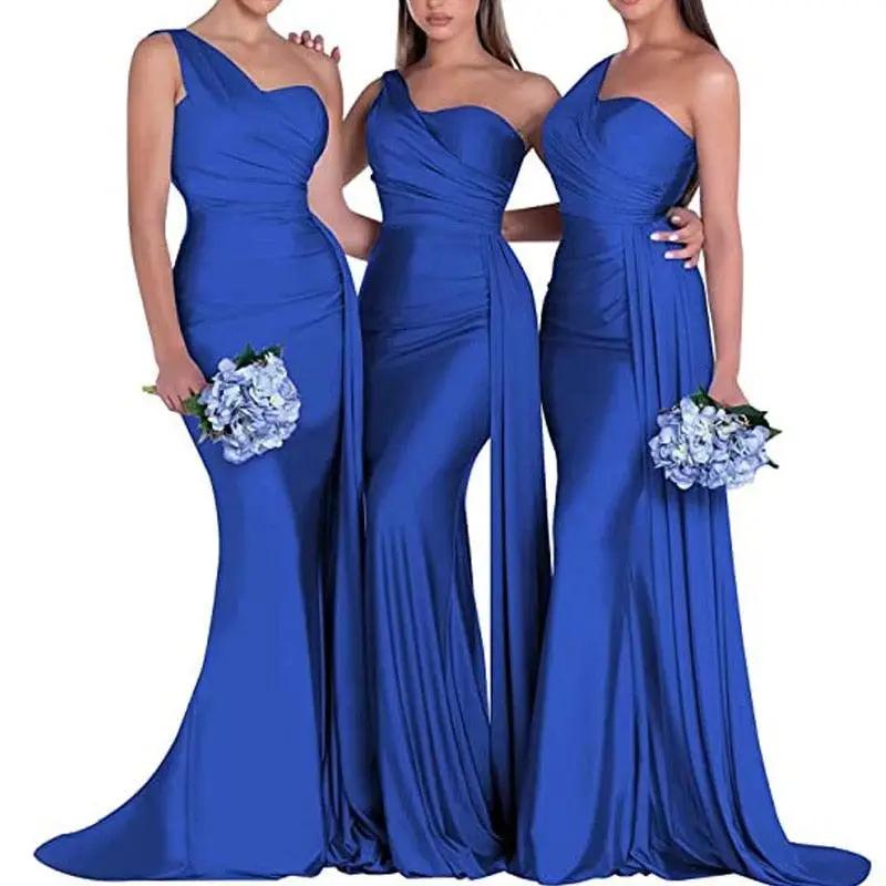 three women in blue dresses standing next to each other